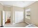 This bedroom features neutral walls and a window overlooking the neighborhood at 357 Marsh Creek Rd, Venice, FL 34292