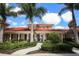 The exterior of a community building featuring stucco walls and a red tile roof at 357 Marsh Creek Rd, Venice, FL 34292