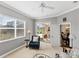 Inviting living room showcasing a sliding door to the lanai and view to the dining room at 357 Marsh Creek Rd, Venice, FL 34292