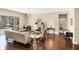 Bright, open living space with hardwood floors, fireplace, and views of the pool at 357 Marsh Creek Rd, Venice, FL 34292