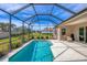 The screened-in pool and patio provide a relaxing outdoor area, perfect for enjoying a refreshing dip at 357 Marsh Creek Rd, Venice, FL 34292