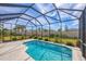 The beautiful screened-in pool and patio area offers a refreshing escape for relaxation and recreation at 357 Marsh Creek Rd, Venice, FL 34292