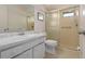 Neat bathroom with shower and updated vanity at 407 Degas Dr, Nokomis, FL 34275