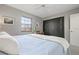 Serene bedroom with a king-size bed and closet at 407 Degas Dr, Nokomis, FL 34275