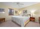 Spacious bedroom with a king-size bed and ample natural light at 407 Degas Dr, Nokomis, FL 34275