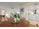 Bright dining area with kitchen and living room views at 407 Degas Dr, Nokomis, FL 34275