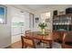 Dining room with view of kitchen and wood table at 407 Degas Dr, Nokomis, FL 34275