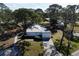Single-story home with attached garage and manicured lawn at 407 Degas Dr, Nokomis, FL 34275