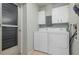 Laundry room with washer, dryer, and exterior access at 407 Degas Dr, Nokomis, FL 34275