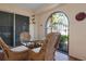 Cozy patio with wicker furniture and access to the outdoors at 407 Degas Dr, Nokomis, FL 34275