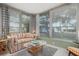 Sunroom with ample natural light and comfortable seating at 407 Degas Dr, Nokomis, FL 34275