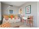 Sunroom with daybed and bright, colorful decor at 407 Degas Dr, Nokomis, FL 34275