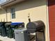 Exterior utilities including trash cans and a grill at 4091 Pomeroy St, North Port, FL 34291