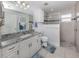 Bathroom with granite vanity and a walk-in shower at 4251 Oak Terrace Cir, Port Charlotte, FL 33953