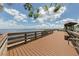 Wooden boardwalk with benches offering water views at 4251 Oak Terrace Cir, Port Charlotte, FL 33953