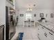 Kitchen dining area with granite countertop and white table at 4251 Oak Terrace Cir, Port Charlotte, FL 33953