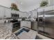 Modern kitchen with stainless steel appliances and granite countertops at 4251 Oak Terrace Cir, Port Charlotte, FL 33953