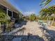 Inviting patio with brick pavers, grill, and outdoor seating at 4251 Oak Terrace Cir, Port Charlotte, FL 33953
