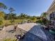 Landscaped patio with seating area and tropical plants at 4251 Oak Terrace Cir, Port Charlotte, FL 33953