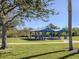 Two covered picnic pavilions with grills and picnic tables at 4251 Oak Terrace Cir, Port Charlotte, FL 33953