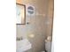 Small bathroom with toilet, sink, and wall mounted fan at 426 Boxwood Dr, Venice, FL 34285