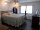 Cozy bedroom with a double bed and a dresser at 426 Boxwood Dr, Venice, FL 34285