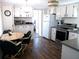 Bright kitchen features modern appliances and a dining area at 426 Boxwood Dr, Venice, FL 34285