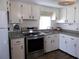 Clean kitchen with stainless steel appliances and wood flooring at 426 Boxwood Dr, Venice, FL 34285