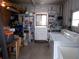 Laundry room with washer, dryer, and storage shelves at 426 Boxwood Dr, Venice, FL 34285
