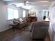 Relaxing living room with comfortable seating and wood floors at 426 Boxwood Dr, Venice, FL 34285