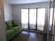 Bright living room features a comfy sofa and large windows at 426 Boxwood Dr, Venice, FL 34285