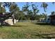 Backyard view with chain link fence and shed at 451 Home Park Rd, Venice, FL 34285