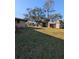 Large grassy backyard with a detached garage at 451 Home Park Rd, Venice, FL 34285
