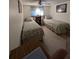 Guest bedroom with two twin beds and built-in shelving at 451 Home Park Rd, Venice, FL 34285