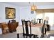Dining room with a table set for six and built in hutch at 451 Home Park Rd, Venice, FL 34285