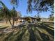 House with a spacious yard and covered patio at 451 Home Park Rd, Venice, FL 34285
