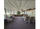 Bright Florida room with seating area and ceiling fan at 451 Home Park Rd, Venice, FL 34285