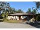 Single story home with carport and landscaping at 451 Home Park Rd, Venice, FL 34285