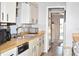 Kitchen with light wood cabinets and appliances at 451 Home Park Rd, Venice, FL 34285