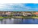 Aerial view of lakefront homes with swimming pools at 4621 Gaeta Dr, Venice, FL 34293