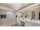 Large bathroom with double vanity and glass block shower at 4621 Gaeta Dr, Venice, FL 34293