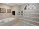 Relaxing bathroom with soaking tub and glass block shower at 4621 Gaeta Dr, Venice, FL 34293