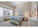 Charming bedroom with window seating and soft color scheme at 4621 Gaeta Dr, Venice, FL 34293