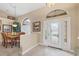 Bright entryway with hardwood floors and access to dining room at 4621 Gaeta Dr, Venice, FL 34293