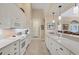 White kitchen with ample counter space and stainless steel appliances at 4621 Gaeta Dr, Venice, FL 34293