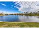 Peaceful lake view with lush green grass at 4621 Gaeta Dr, Venice, FL 34293