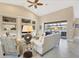 Spacious living room with vaulted ceilings, tile floors, and access to a lanai at 4621 Gaeta Dr, Venice, FL 34293