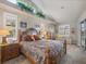 Main bedroom with king-size bed and access to the pool area at 4621 Gaeta Dr, Venice, FL 34293
