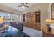 Home office with built-in shelving and comfortable seating at 4621 Gaeta Dr, Venice, FL 34293