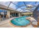 Relaxing pool area with spa and screened enclosure at 4621 Gaeta Dr, Venice, FL 34293